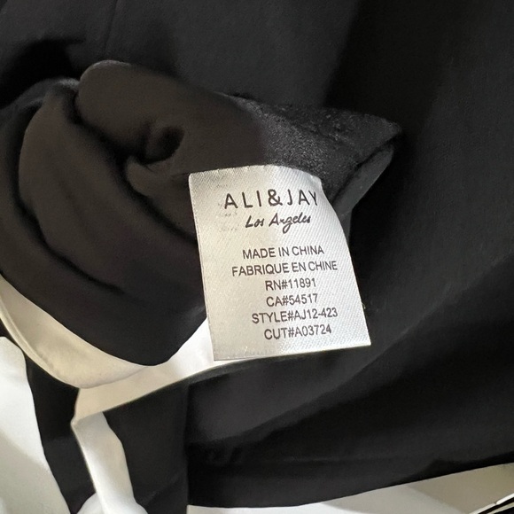 ALI & JAY Elegant Black Dress with White Accents - Picture 9 of 10